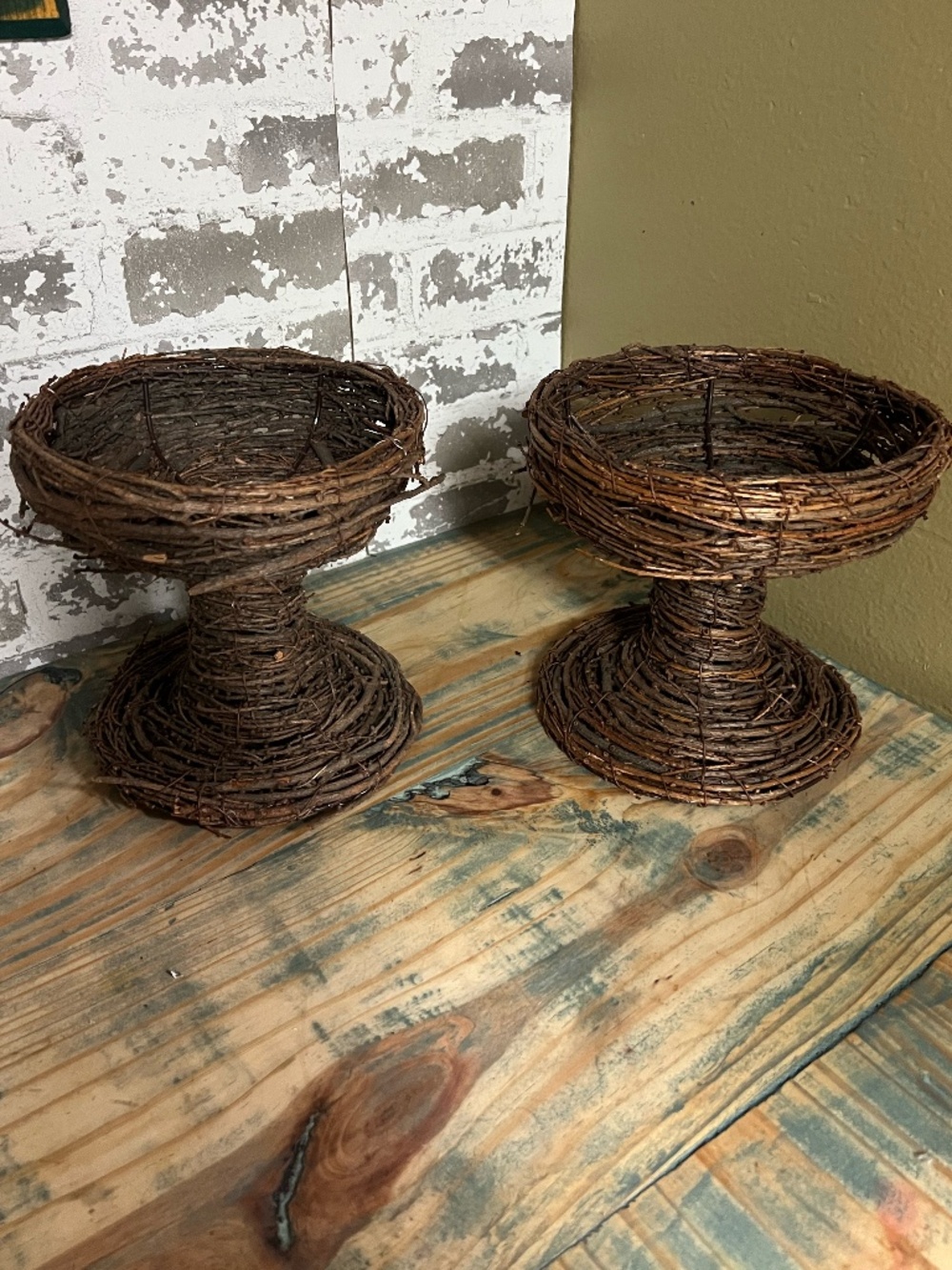 Pair of rustic, hand-woven vine and twig decorative pedestals candle holders